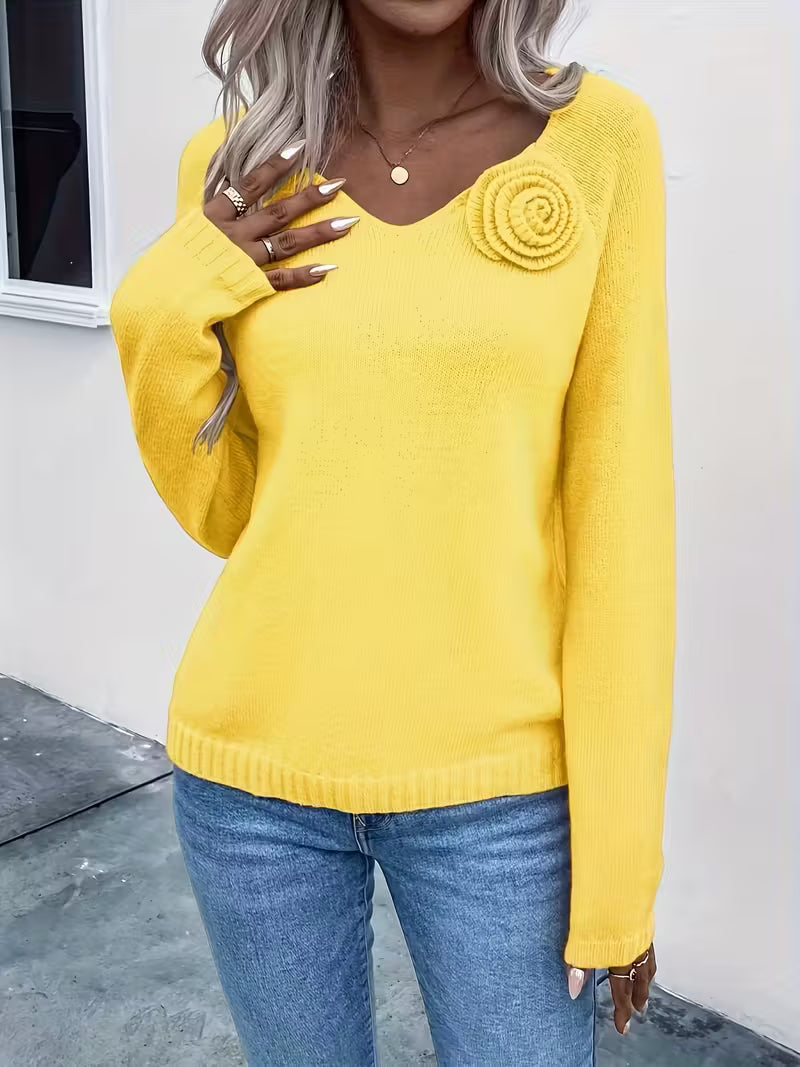 Maglione primaverile con dettagli floreali